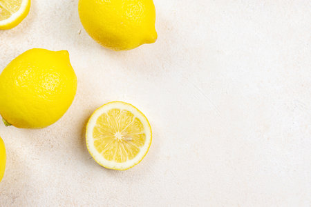 Fresh lemons on bright background. Lemon fruit citrus. Composition with whole, slices of lemons.の写真素材