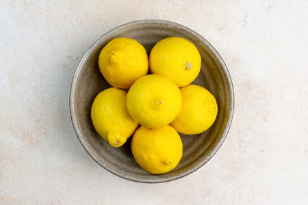 whole yellow lemons isolated on bright background. Lemons citrus fruit, healthy, summer. Copy spaceの写真素材