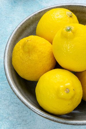 whole yellow lemons isolated on bright background. Lemons citrus fruit, healthy, summer. Copy spaceの写真素材