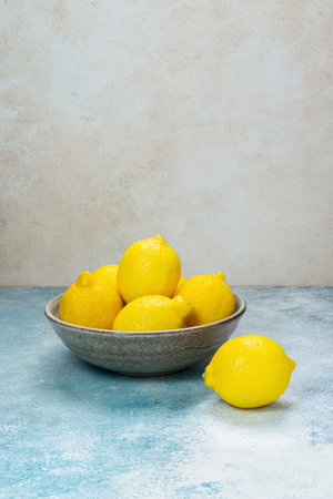 whole yellow lemons isolated on bright background. Lemons citrus fruit, healthy, summer. Copy spaceの写真素材