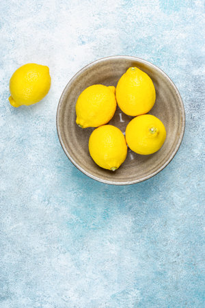 whole yellow lemons isolated on bright background. Lemons citrus fruit, healthy, summer. Copy spaceの写真素材