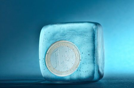 One euro coin frozen in ice cubeの写真素材