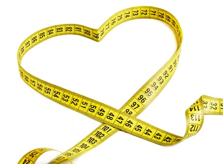 Measurement tape forming the shape of a heartの写真素材