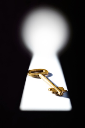 A key seen through a keyholeの写真素材