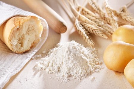 Homemade bread scene with wheat, flour and potatoesの写真素材