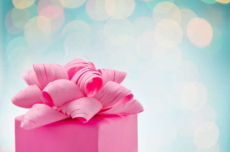 Christmas gift wrapped with bow, close-upの写真素材
