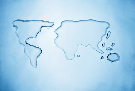 Spilled water shaping the world mapの写真素材