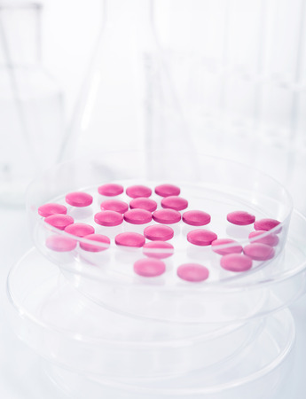 Petri dish with pills in research labの写真素材