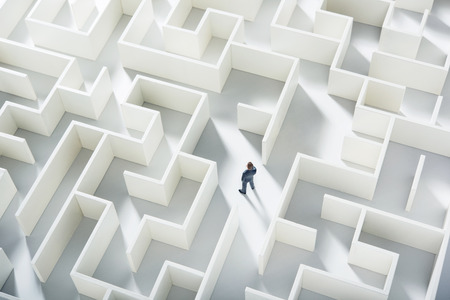 Business challenge. A businessman navigating through a maze. Top viewの写真素材
