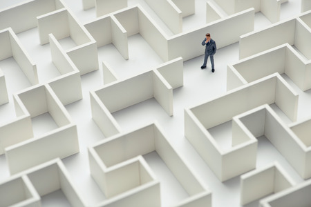 Business challenge. A businessman navigating through a maze. Top viewの写真素材