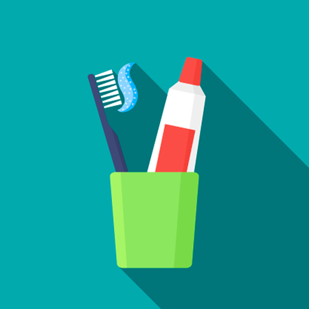 Toothbrush, toothpaste in a glass vector illustration.のイラスト素材