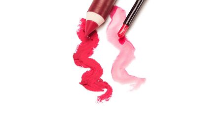 Red lip liner and lip gloss on white backgroundの写真素材