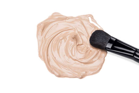 Close-up of foundation with makeup brush on white backgroundの写真素材