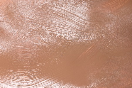 Makeup background. Smeared liquid fluid foundation. Central focusの写真素材