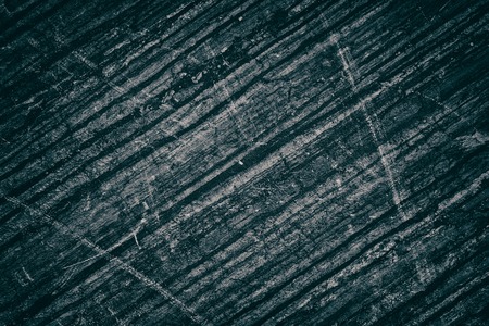 Old weathered concrete wall. Aged scratched dark grey texture. Shabby grunge backgroundの写真素材
