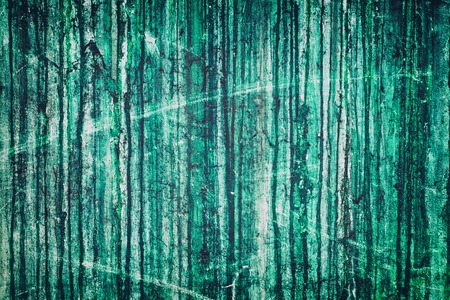 Aged weathered green concrete wall with dark drips. Shabby color cement texture. Grunge backgroundの写真素材