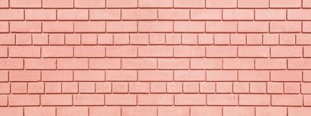 Coral painted brickwork wide background. Brick block widescreen texture. Peach color wall panorama