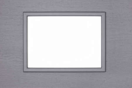 Gray wooden picture frame with blank white poster mock-up on gray painted wood wall. Creative mockup backgroundの写真素材