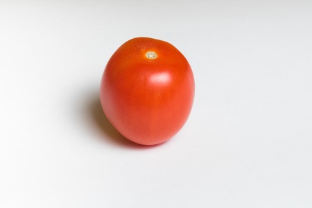 Fresh red tomato isolated on white backgroundの写真素材