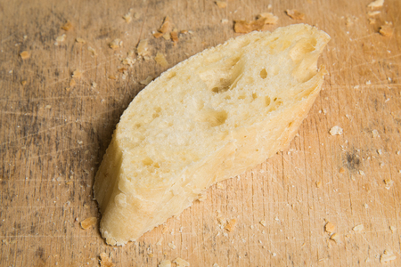 View of sliced bread on a wooden table.