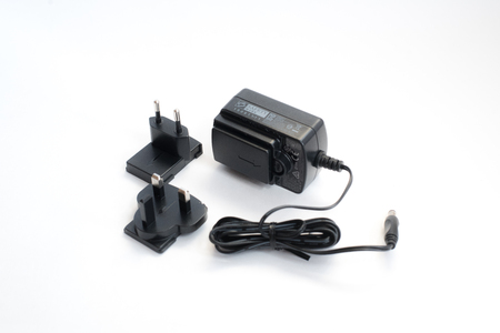 Laptop or mobile charger power adapter isolated on white background