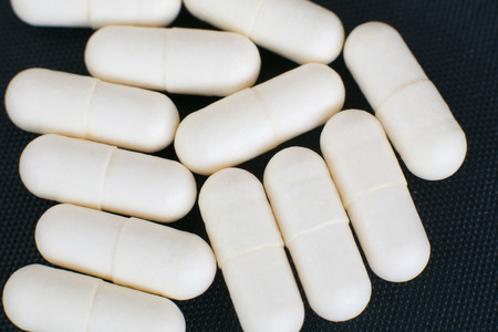 Pharmacy theme, white medicine pills on white background