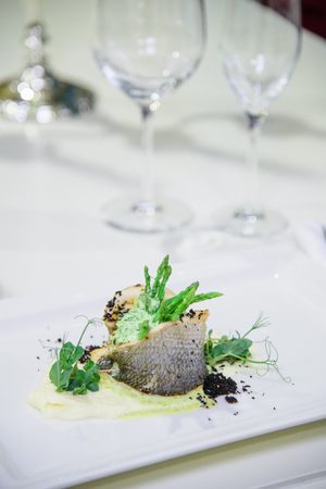 Chef s specialty presented in restaurant on served table.の写真素材