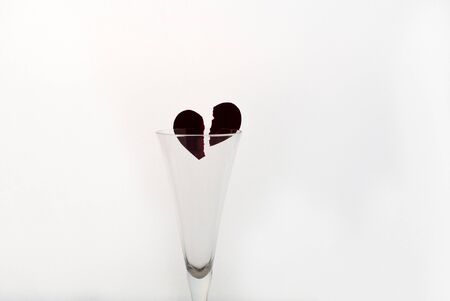 Wineglasse with heart on white background and place for signatureの写真素材