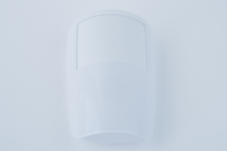 Intruder alarm system with motion sensorisolated on white background.の写真素材