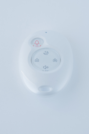 Intruder alarm system with motion sensorisolated on white background.