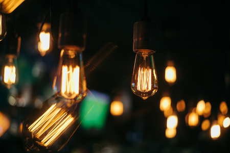 Closeup view of contemporary light fixture in dark room