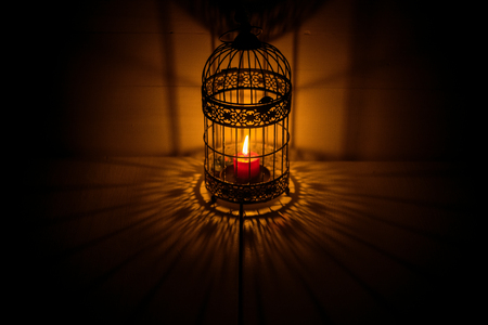 Closeup view of contemporary light fixture in dark roomの写真素材
