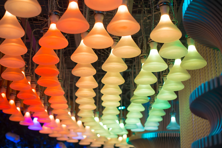 Closeup view of contemporary light fixture in dark roomの写真素材