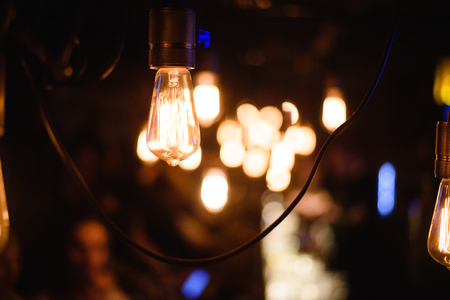 Closeup view of contemporary light fixture in dark room