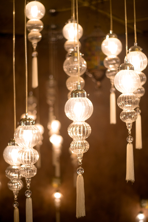 Closeup view of contemporary light fixture in dark roomの写真素材