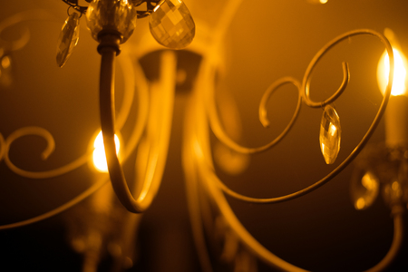 Closeup view of contemporary light fixture in dark roomの写真素材
