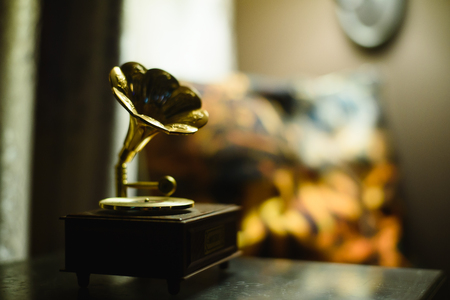 vintage mini gramophone with blur background, old music soundの写真素材