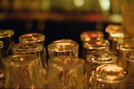 Empty glasses on table in night club or restaurant, closeupの写真素材