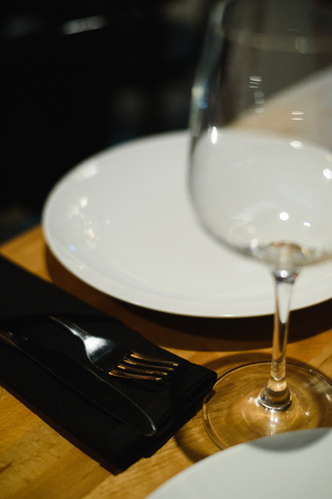 Empty glasses on table in club or restaurant, closeupの写真素材