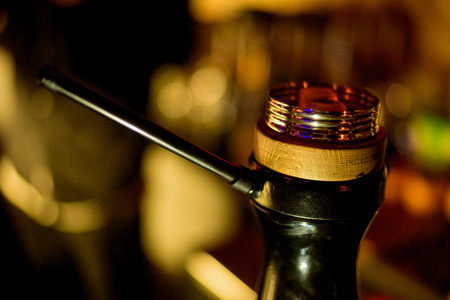 Hookah hot coals on shisha bowl with black background. Stylish oriental shisha.の写真素材
