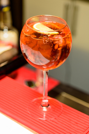 Alcohol bar, cocktail glass on bar counter, cocktail glass in a bar, Drinking cocktail in bar, cocktail in the glass with straws, Fresh drink coctailの写真素材