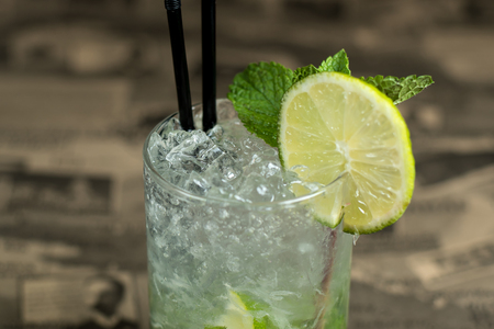 Alcohol bar, cocktail glass on bar counter, cocktail glass in a bar, Drinking cocktail in bar, cocktail in the glass with straws, Fresh drink coctailの写真素材