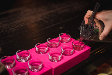 Alcohol bar, cocktail glass on bar counter, cocktail glass in a bar, Drinking cocktail in bar, cocktail in the glass with straws, Fresh drink coctailの写真素材