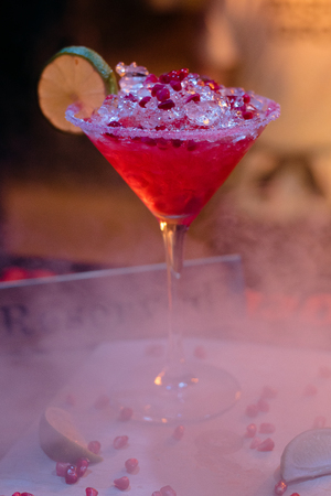 Alcohol bar, cocktail glass on bar counter, cocktail glass in a bar, Drinking cocktail in bar, cocktail in the glass with straws, Fresh drink coctailの写真素材