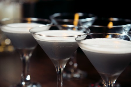 Alcohol bar, cocktail glass on bar counter, cocktail glass in a bar, Drinking cocktail in bar, cocktail in the glass with straws, Fresh drink coctailの写真素材