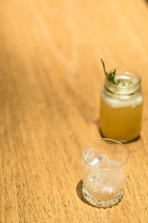 Alcohol bar, cocktail glass on bar counter, cocktail glass in a bar, Drinking cocktail in bar, cocktail in the glass with straws, Fresh drink coctailの写真素材