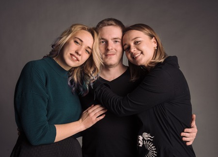 Three young friends standing together, The studio shotの写真素材