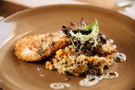 Chef's specialty presented in restaurant on served table.の写真素材