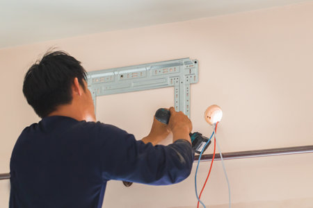 Air conditioning technicians install new air conditioners in homes, Repairman fix air conditioning...