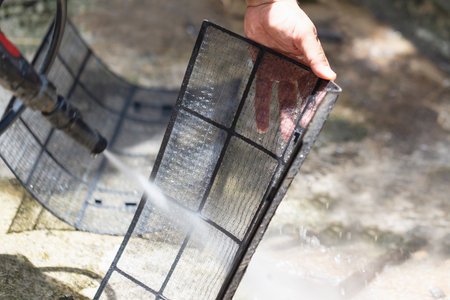 Repairman cleaning air conditioning, Air Conditioning Repair, Male technician service for repair and maintenance of air conditionersの写真素材